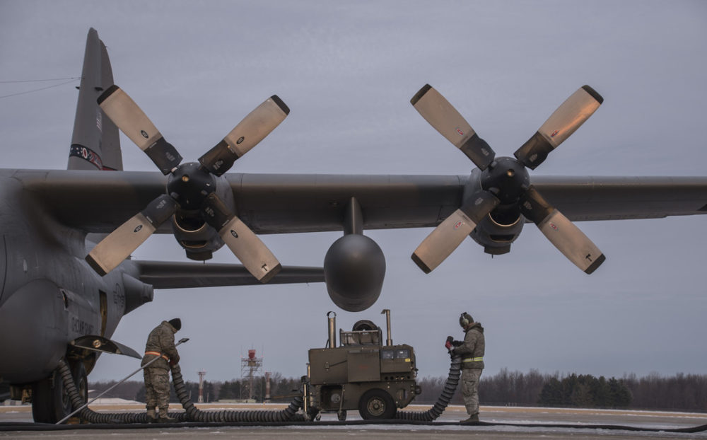 Members of the 179th Airlift Wing Maintenance Group heat the four turbo prop engines of a C-130H Hercules in the cold, early morning Dec. 21, 2016, on the 179th AW flightline in Mansfield, Ohio, as part of daily winter operations. The 179th AW is always on a mission to be the first choice to respond to state and federal missions with a trusted team of Airmen.