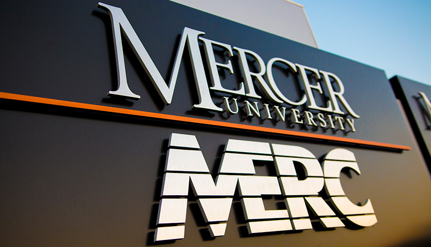 large outdoor sign for MERC at its facility, it has their name and the Mercer University name above it on the sign